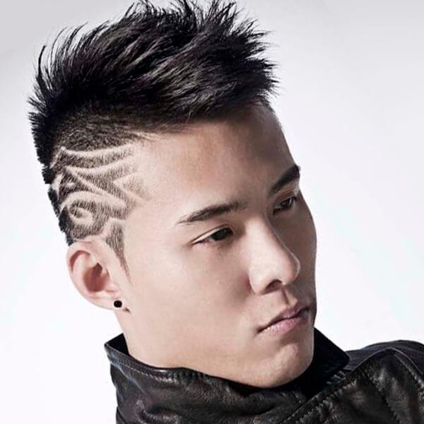 Black undercut hairstyle with shaved designs