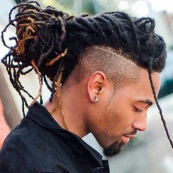 Long dreads and undercut hairstyle with lined pattern for men