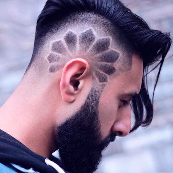 Side undercut hairstyle with shaved design