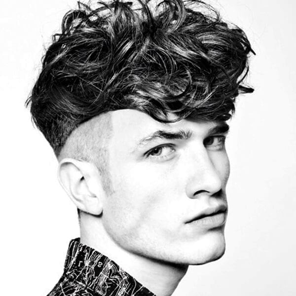 Wavy top and fade undercut hairstyle for men