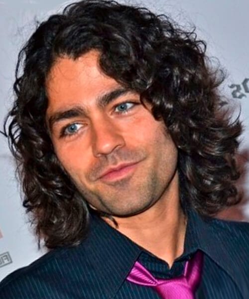 Spiraling curls hairstyle for men with long hair