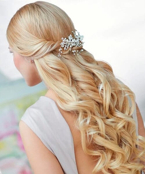 Cascading curls half up wedding hairstyle