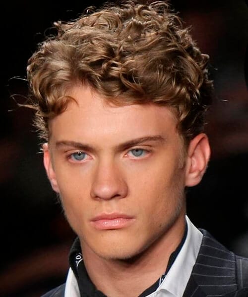 Curly short layered hairstyle for men