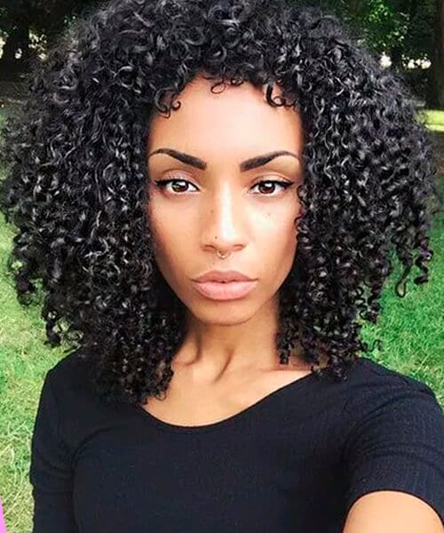 Tight corkscrew curls natural hairstyle for medium length hair