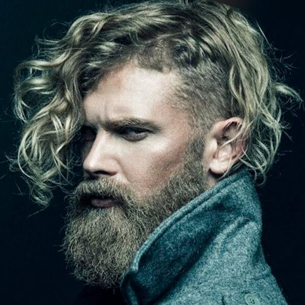 Long wavy men’s undercut hairstyle