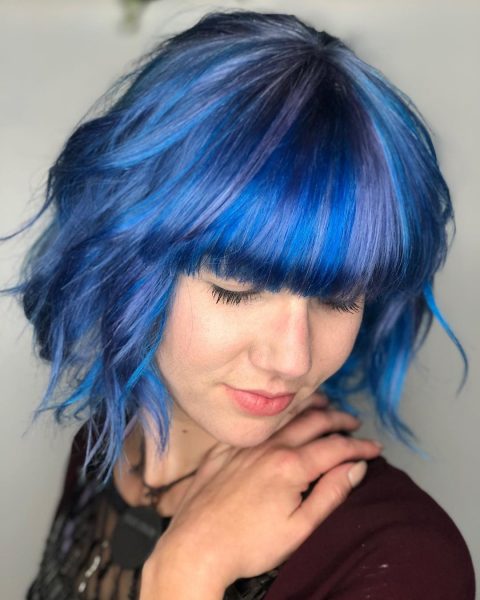 blue-color hairstyle with layers and bangs