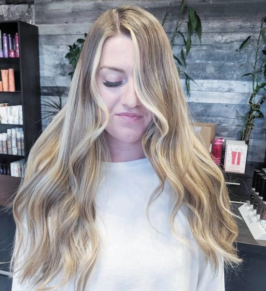 long wavy hair with white highlights