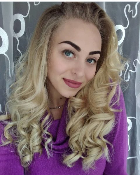 Long Blonde Haircut for Stylish Women with Curls