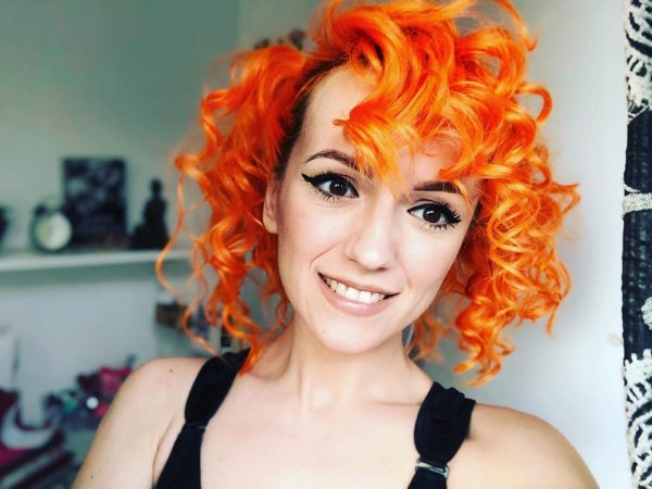 Short Orange Curly Hair with Bangs