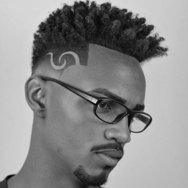 Black Men Natural Curly Hairstyle with Undercut Design