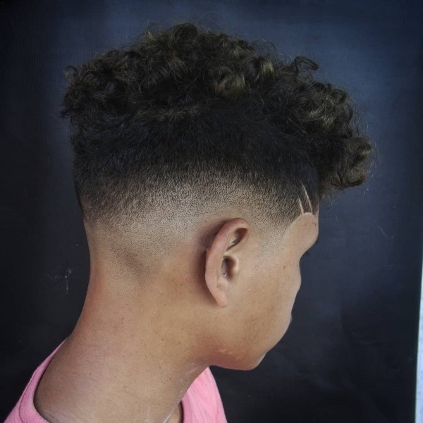 A curled fade haircut for Afro-American boys.