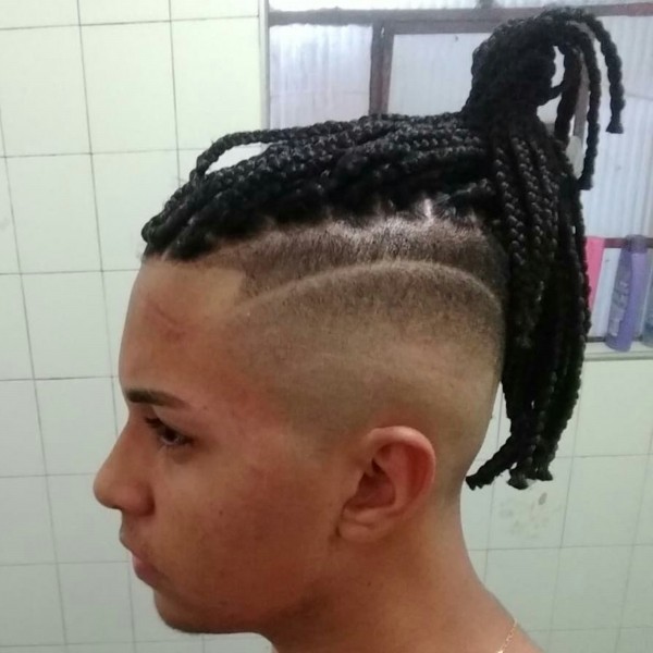 Trendy long haircut for boys with a fade.
