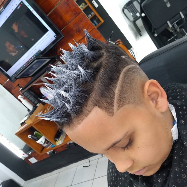 A messy spiky fade haircut for boys.
