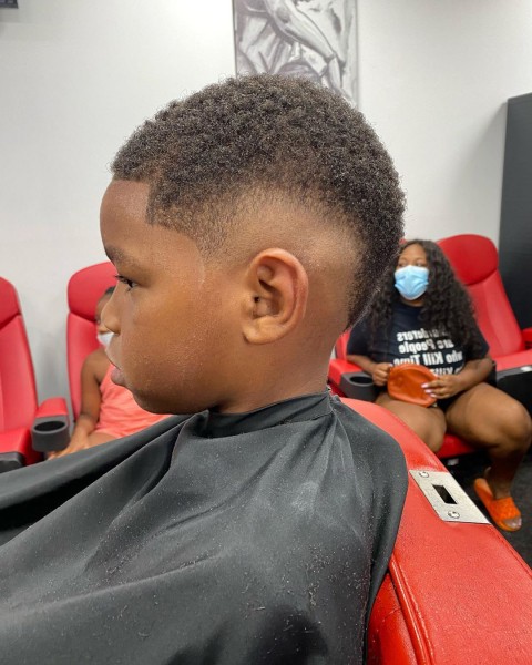 A young boy with a temp fade on toddler boy.