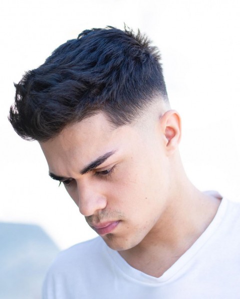 A temple taper fade haircut for young men.