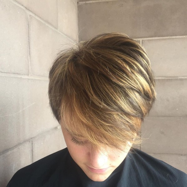 A balayage feathered pixie with bright highlights.