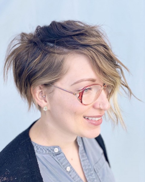 A long pixie haircut for girls who wear glasses.