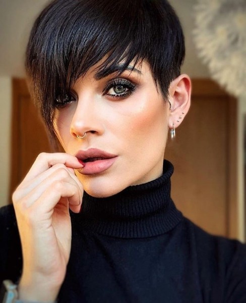 A tapered pixie haircut for short black hair.