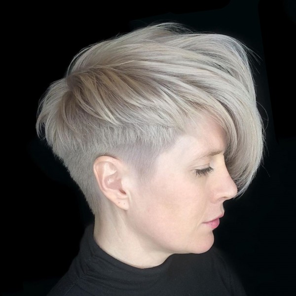 A stylish pixie cut with long bangs.