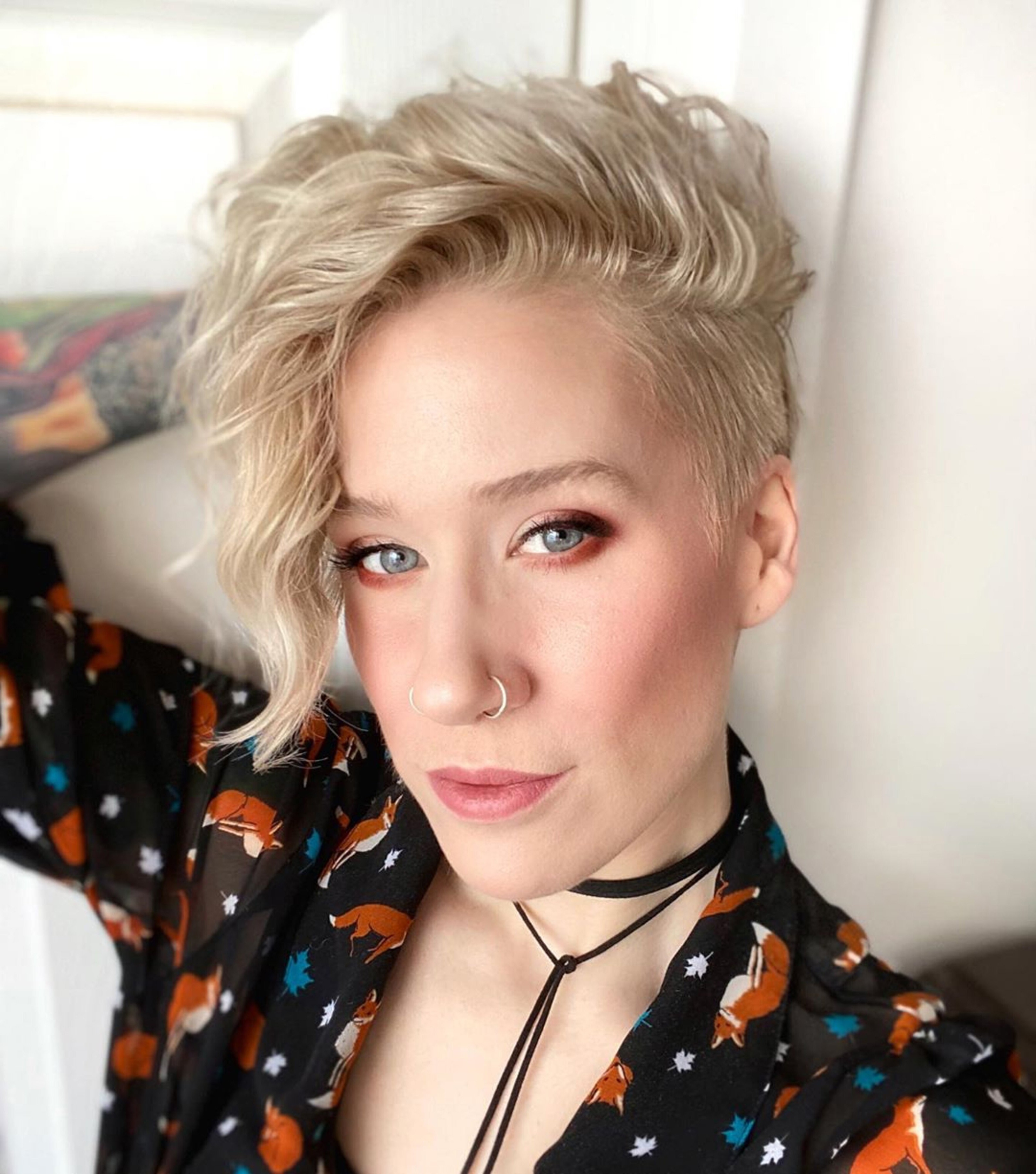 A pixie haircut for girls who wear long side fringe.
