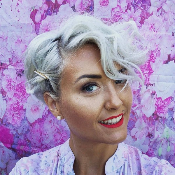 A short grey pixie haircut for everyday wear.