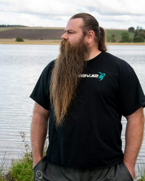A long beard in the biker style.