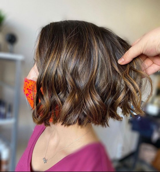 A brown bob with bright highlights.
