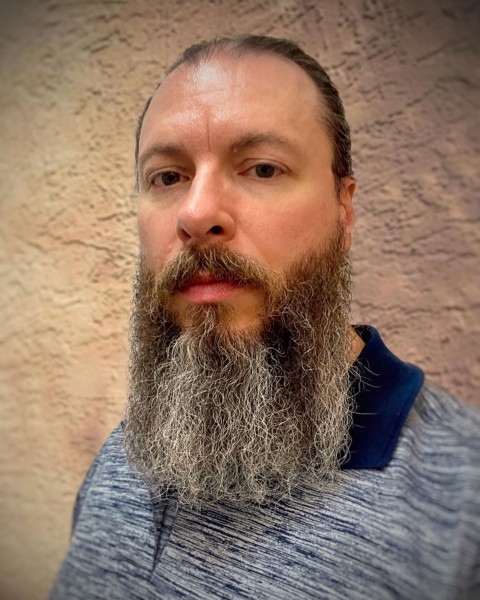 A long bearded style with a buzz cut.