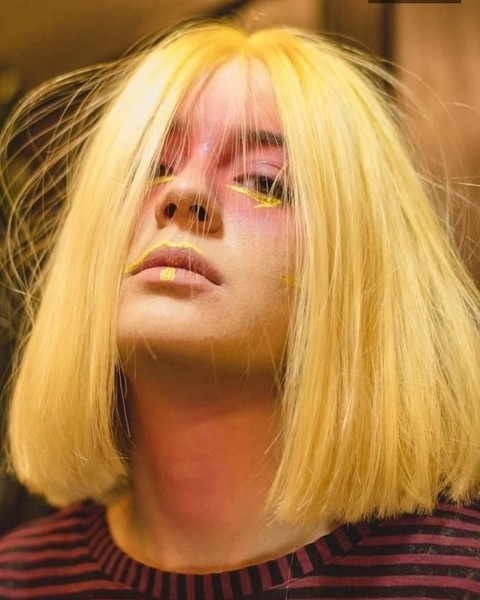 A golden blonde bob haircut.