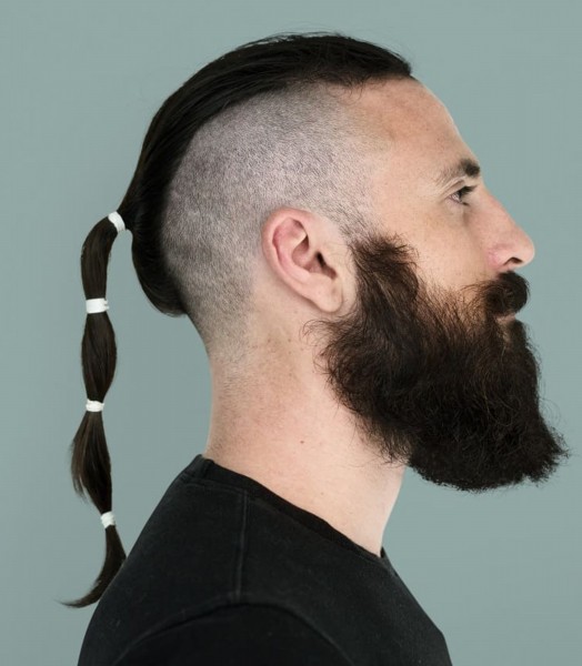 A long beard with a ponytail hairstyle.