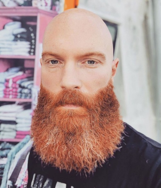 A long beard of the orange color.
