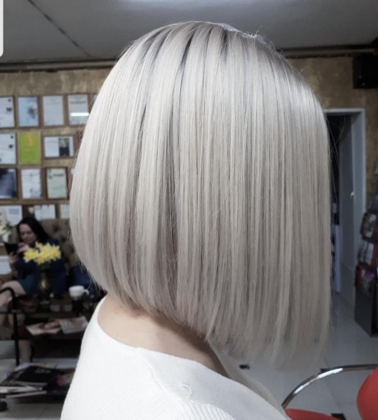 A metallic blonde bob haircut.