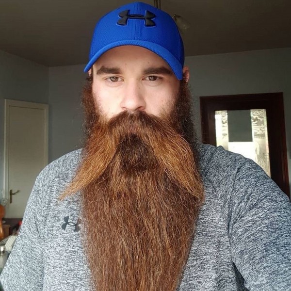A really long stylish beard for males.