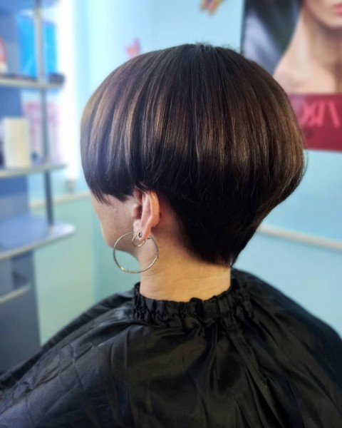 A tapered auburn bob hairstyle.