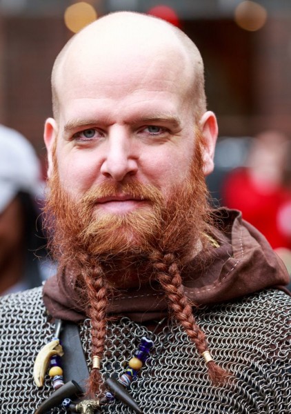 A short beard with braids.