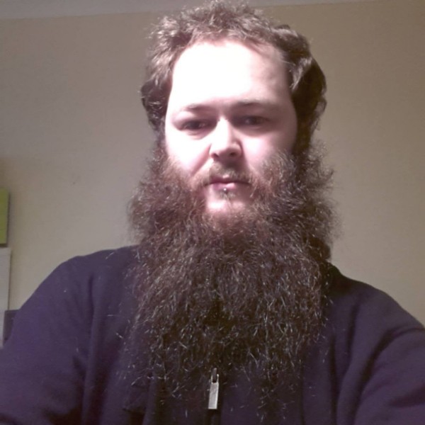 A full untrimmed beard style.