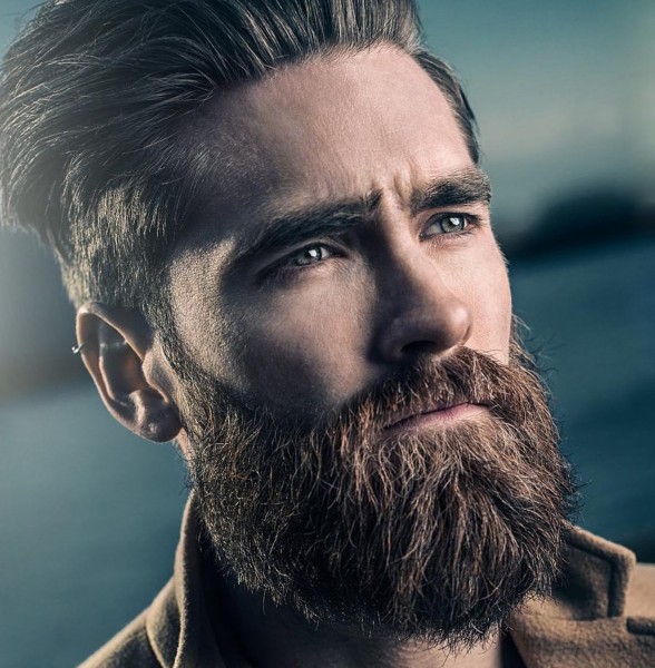 A full beard combined with the high faded style.