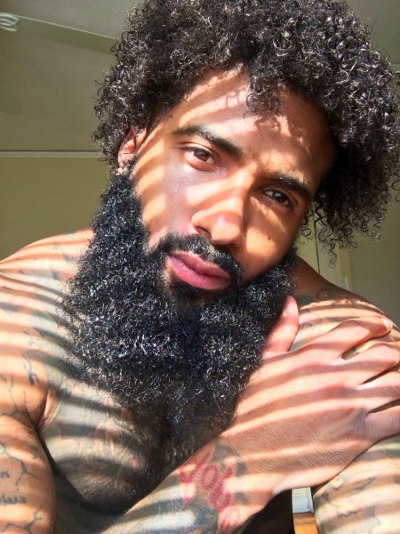 A curled beard style for black men.