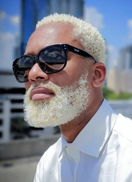 A nice blonde beard style for a black man.