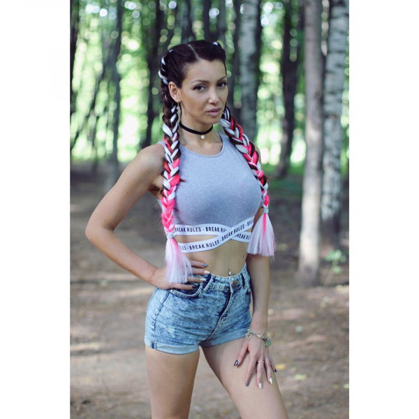 Julia with white pink pigtails in the forest