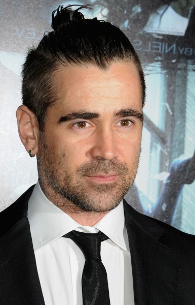 Colin Farrell with a cool bun style.