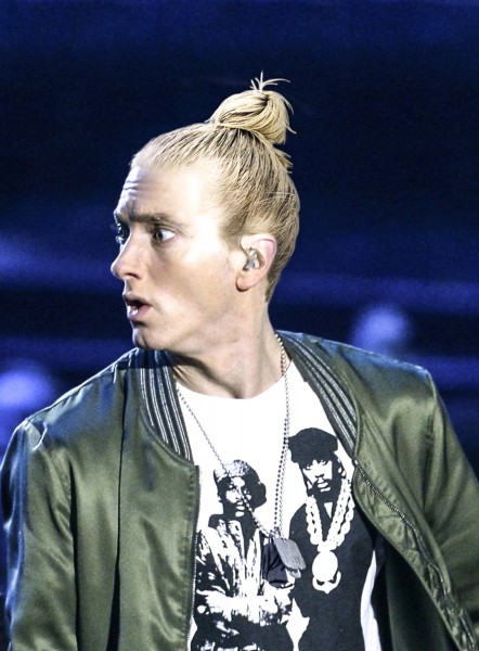 Eminem with a trendy bun style.