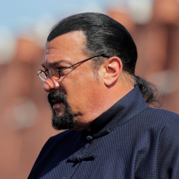 Steven Seagal male hairstyle with a bun.