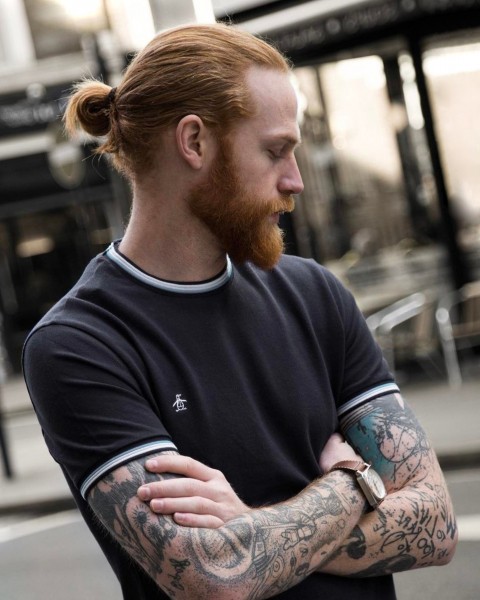 A male bun hairstyle for ginger hair.