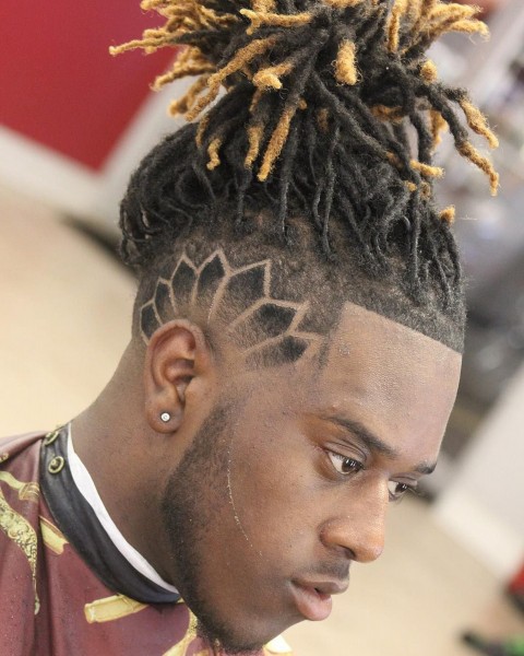 A faded male hairstyle with an original design.