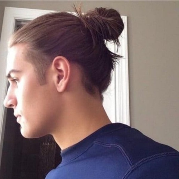 A bun hairstyle for men with straight hair.