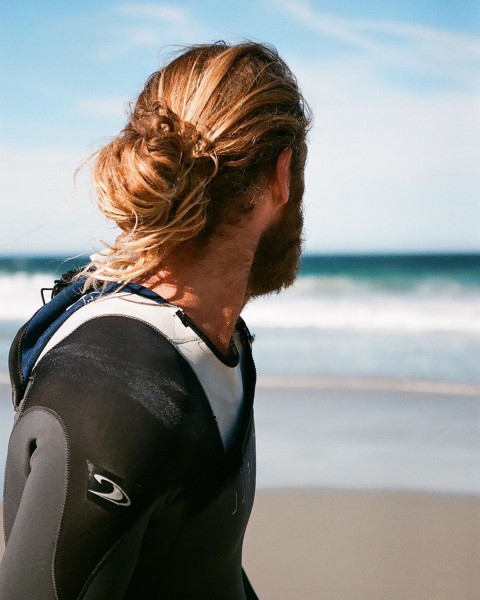 A male bun in the surfer style.