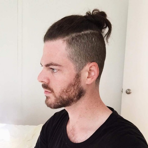 An ugly male bun hairstyle.