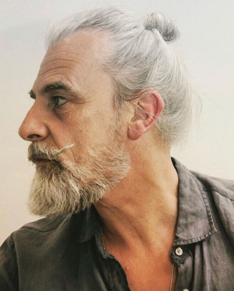 A male haircut with a bun for white haired men.